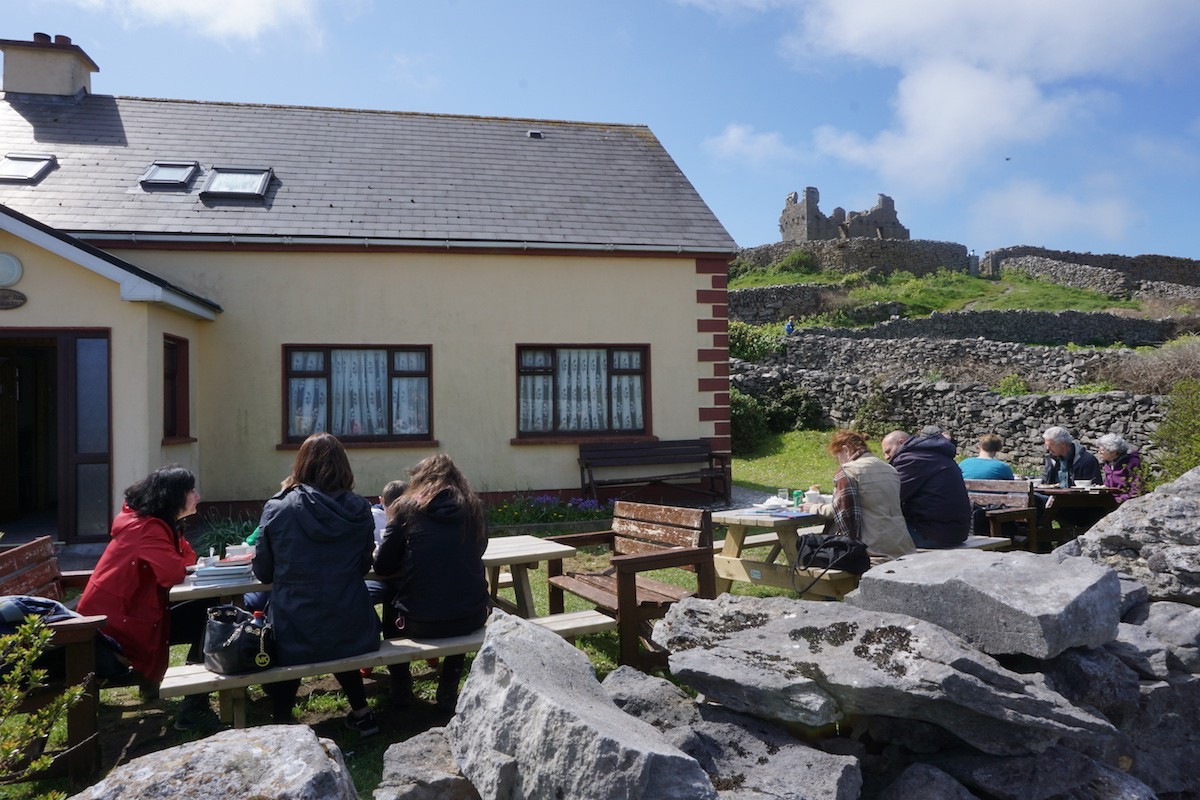 Small cafe, castle in backround on Inis Oirr