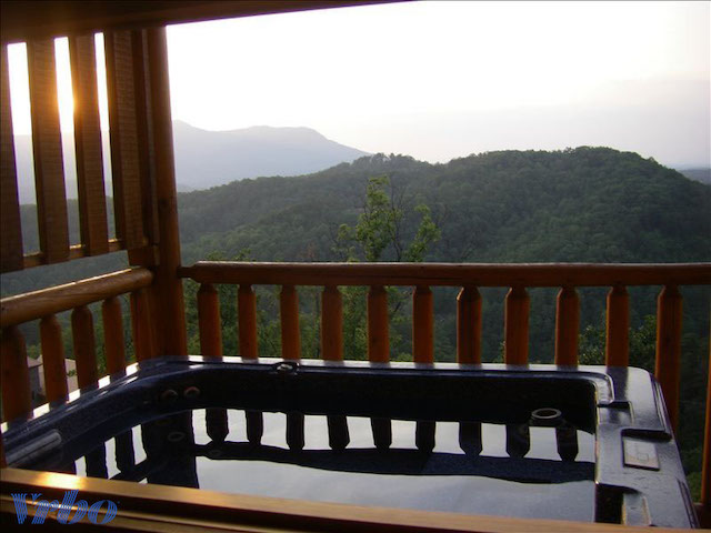 view from cabin with hot tub outside